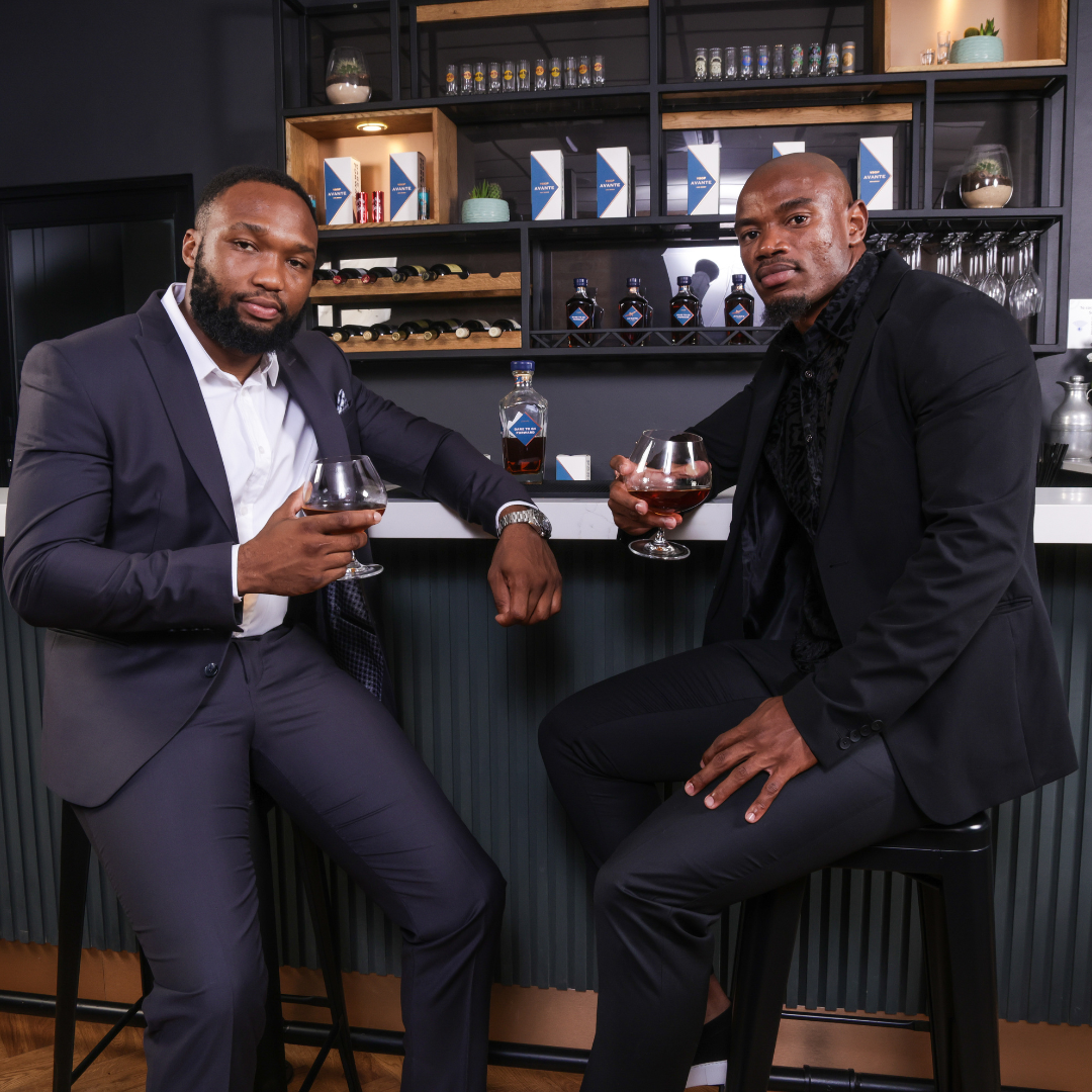 Lukhanyo Am and Makazole Mapimpi enjoying Avante VSOP Brandy.
